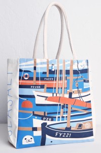 Vintage travel poster style illustration of lugger fishing boats moored in Mevagissey Harbour. By Matt Johnson for Seasalt Cornwall canvas tote bag print.