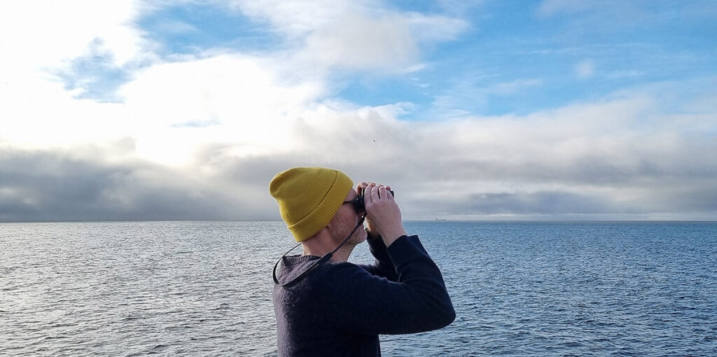 Illustrator Matt Johnson birdwatching on the Scillonian ferry.